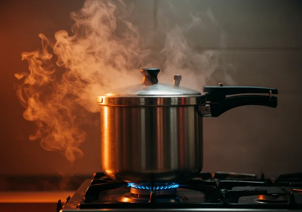 A pressure cooker about to explode, symbolizing the tension buildup in IED